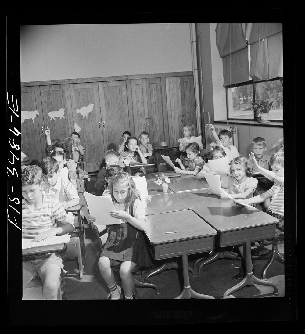 Greenbelt, Maryland. Federal housing project. Third grade children have a discussion about compositions which they have…