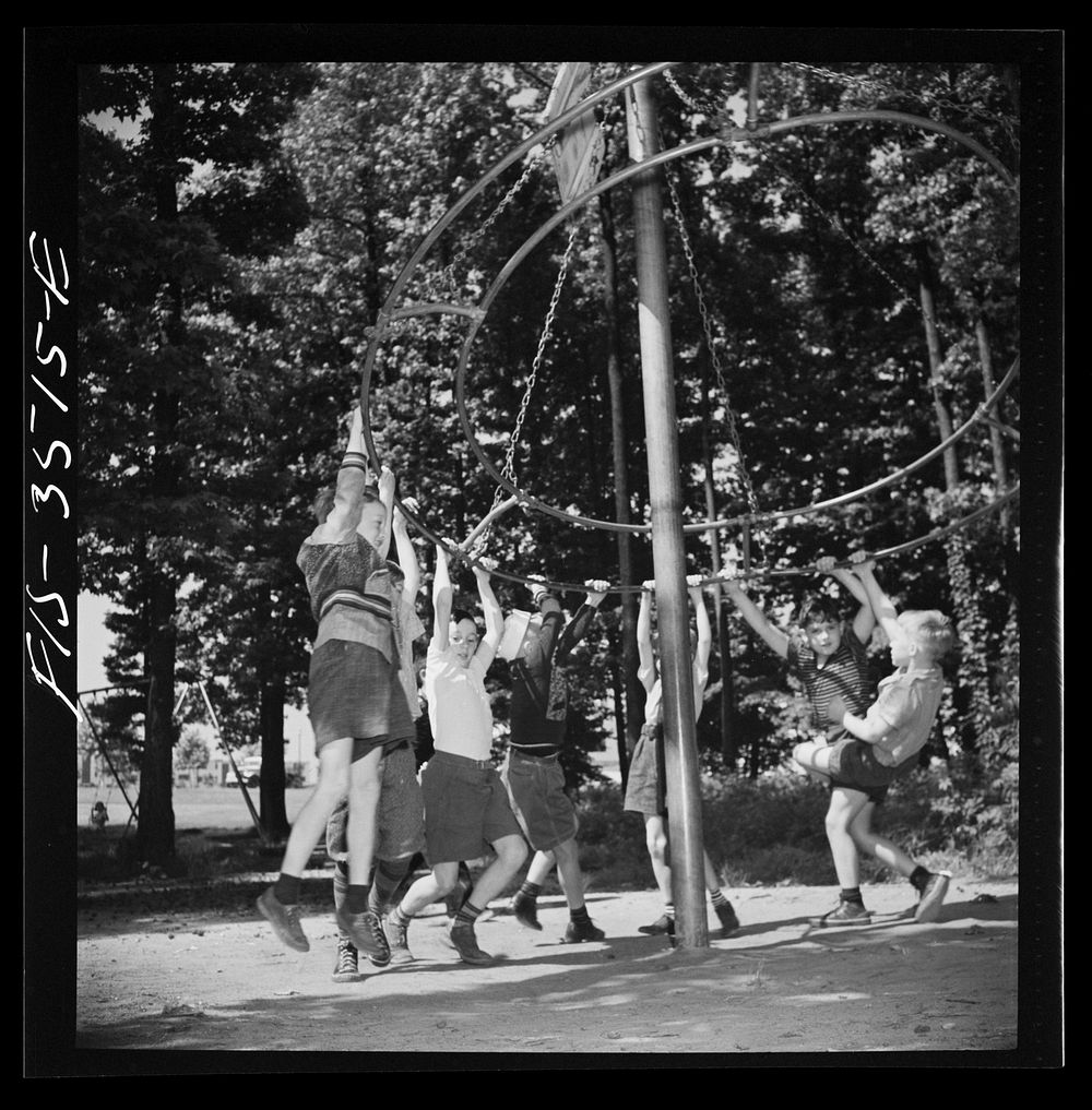 [Untitled photo, possibly related to: Greenbelt, Maryland. Federal housing project. Children playing on apparatus in one of…