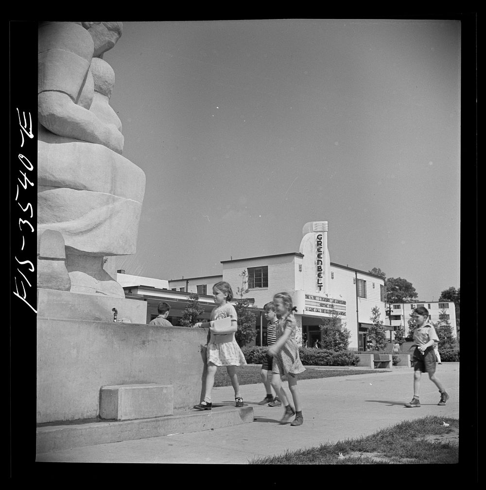 Greenbelt, Maryland. Federal housing project. Children approaching drinking fountain in the shopping center. Sourced from…