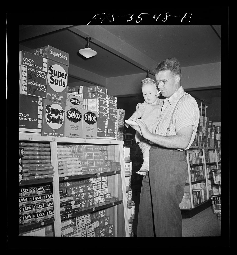 Greenbelt, Maryland. Father and son shopping in the cooperative store. Sourced from the Library of Congress.