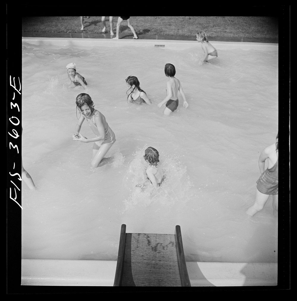 [Untitled photo, possibly related to: Greenbelt, Maryland. A constant stream of water runs down the swimming pool slide].…