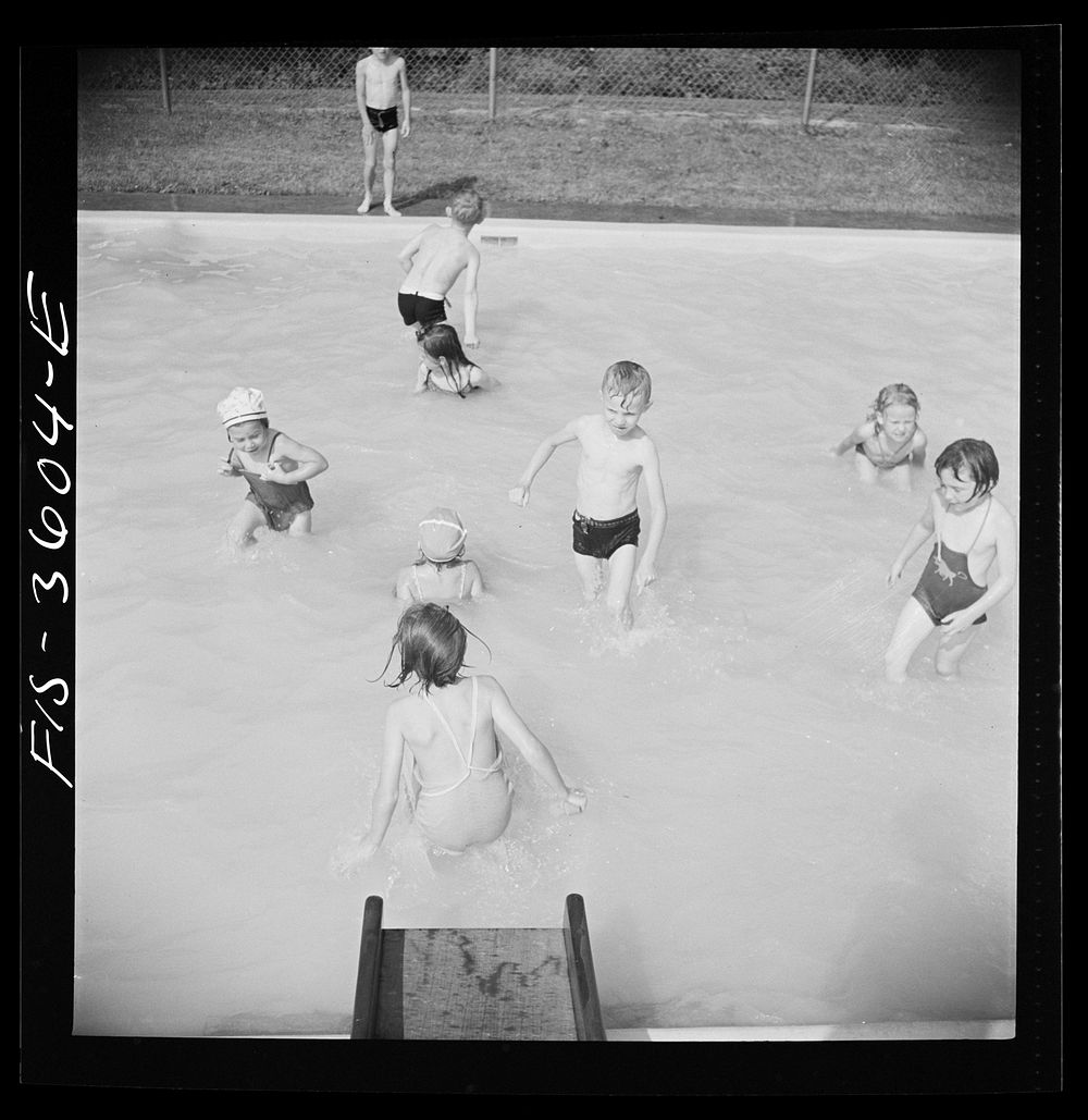 [Untitled photo, possibly related to: Greenbelt, Maryland. A constant stream of water runs down the swimming pool slide].…