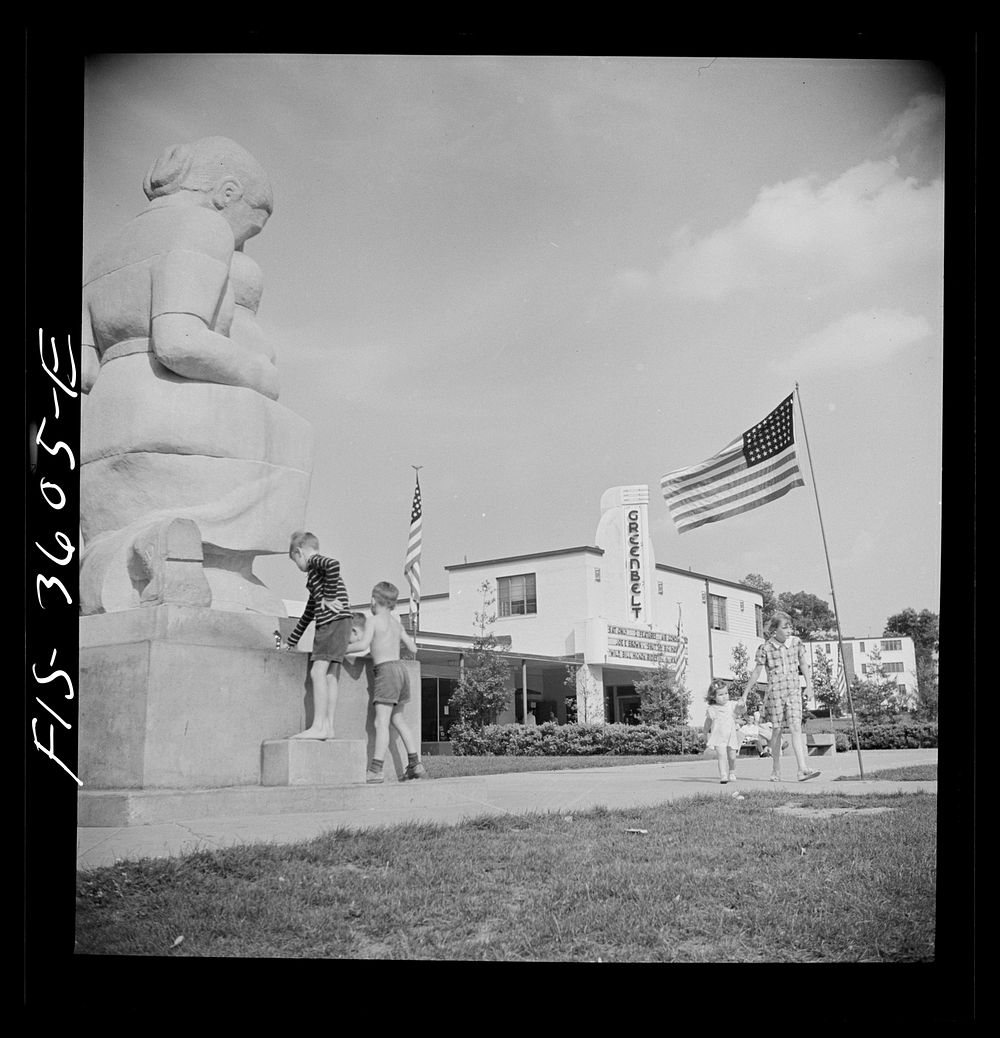 Greenbelt, Maryland. Children drinking at a water fountain in the shopping center on Memorial Day. Sourced from the Library…