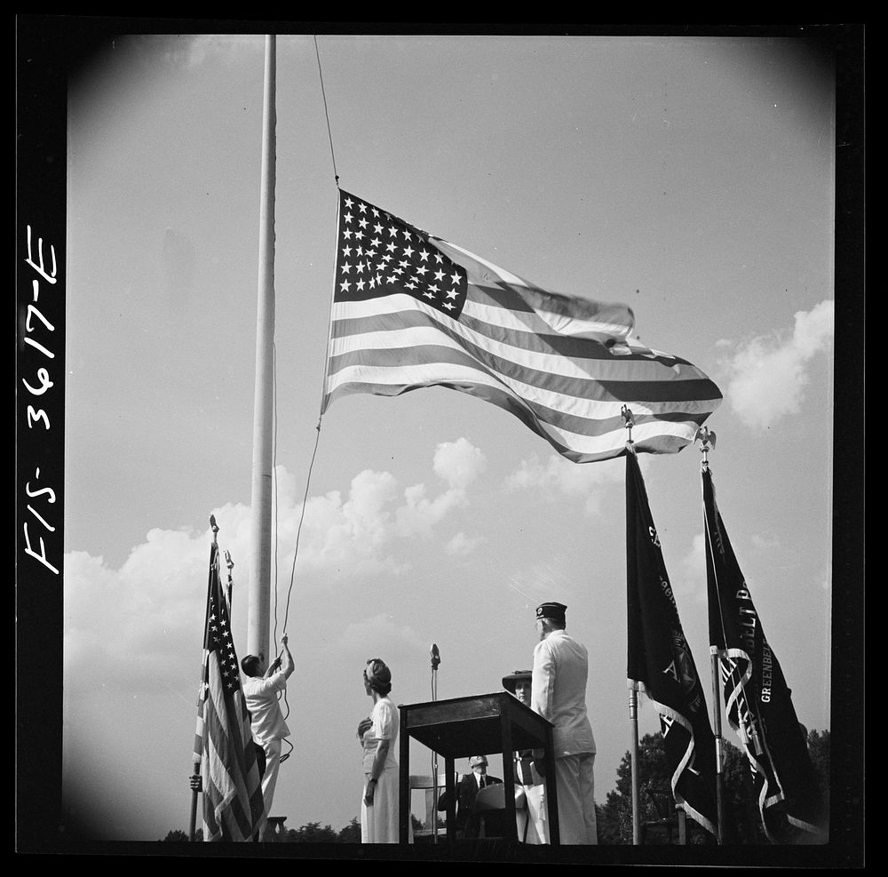 Greenbelt, Maryland. Lowering the flag at Memorial Day ceremonies conducted by the American Legion. Sourced from the Library…