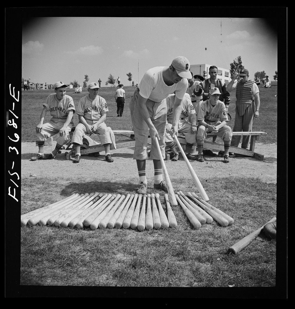 Greenbelt, Maryland. Member of the Greenbelt baseball team picking out a bat. On Sunday the team plays that of a neighboring…