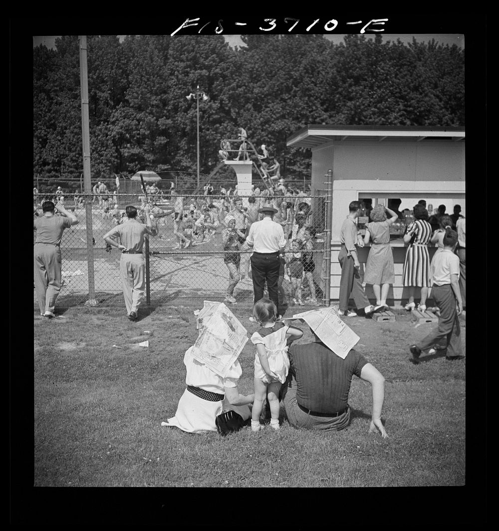 Greenbelt, Maryland. Spectators at the swimming pool. Sourced from the Library of Congress.