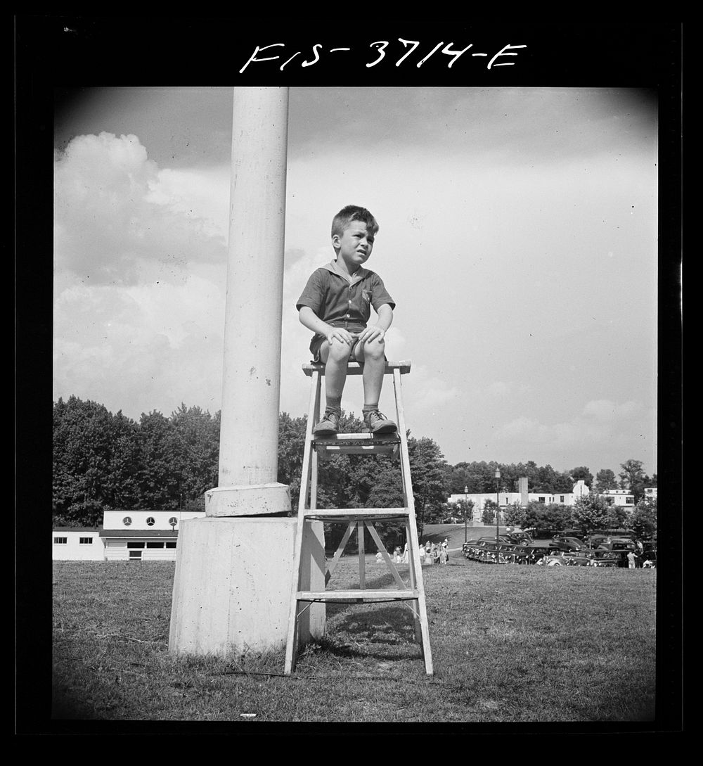 [Untitled photo, possibly related to: Greenbelt, Maryland. Young spectator at the Memorial Day ceremony]. Sourced from the…