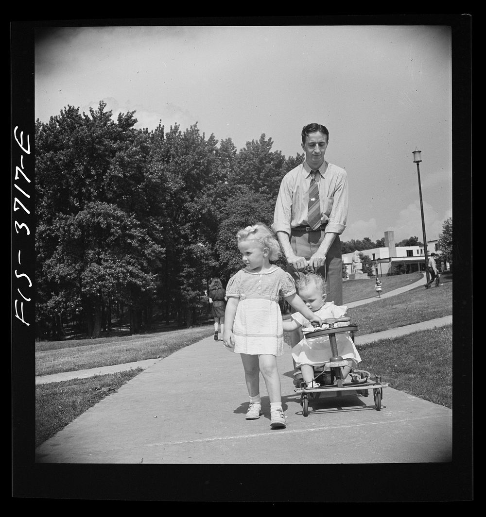 [Untitled photo, possibly related to: Greenbelt, Maryland. Family strolling on Sunday]. Sourced from the Library of Congress.