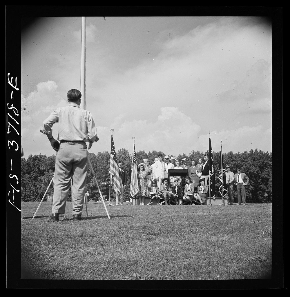 [Untitled photo, possibly related to: Greenbelt, Maryland. Lowering the flag at Memorial Day ceremonies conducted by the…