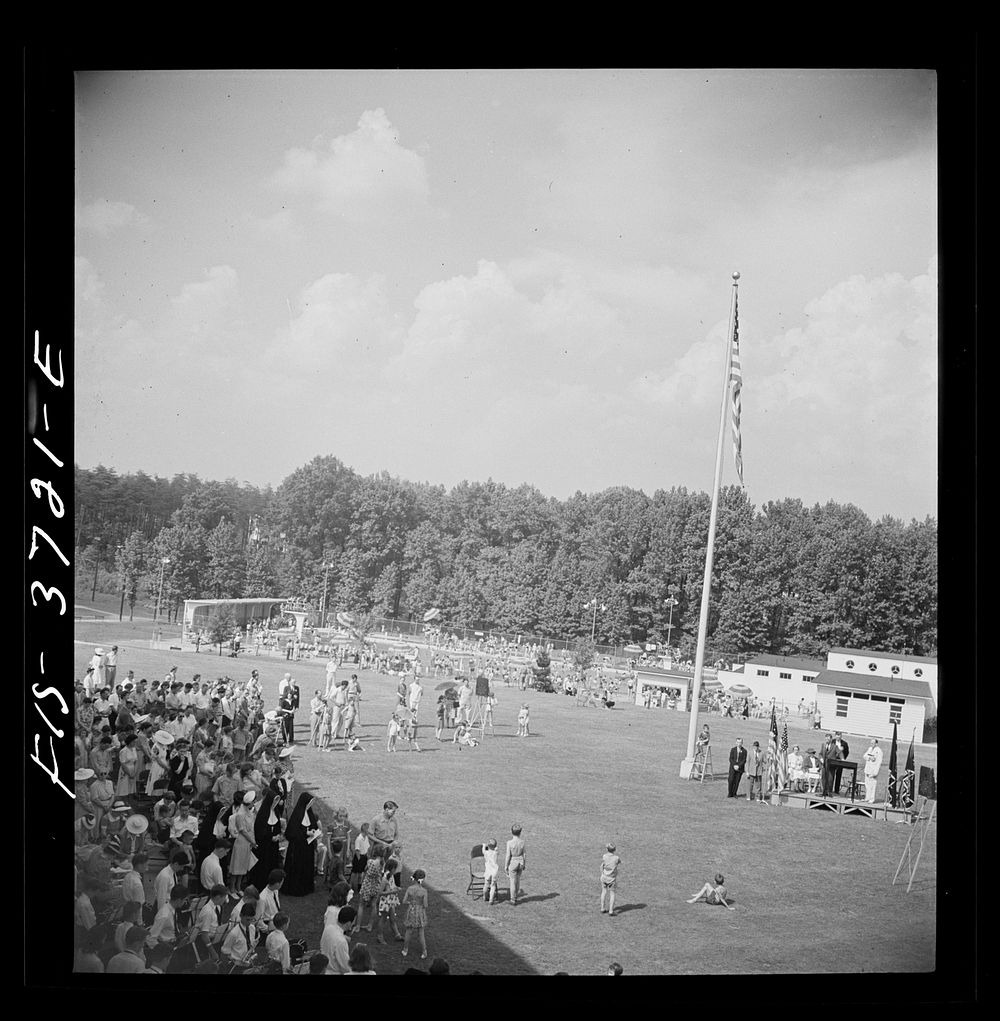Greenbelt, Maryland. Bird's-eye view of the Memorial Day ceremony, with the swimming pool in the background. Sourced from…