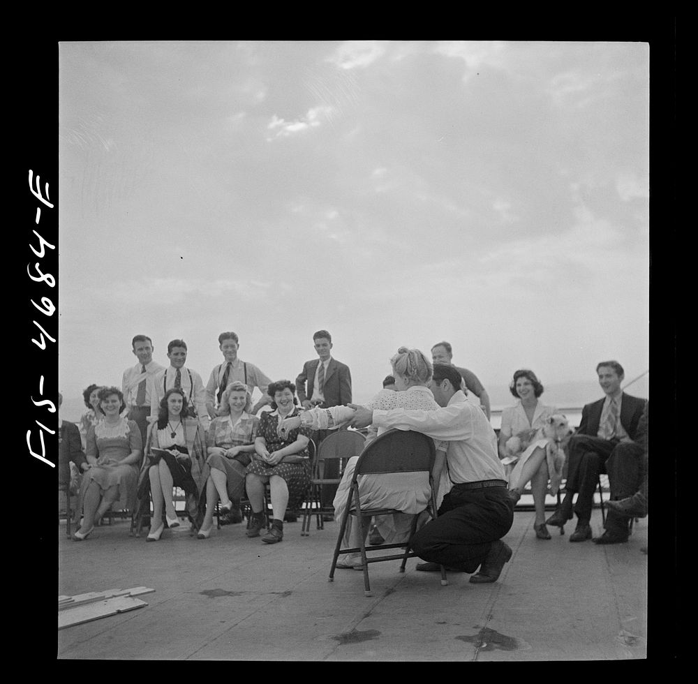 [Untitled photo, possibly related to: Washington, D.C. Bandaging an "injured" arm as part of a course in first aid, aboard a…