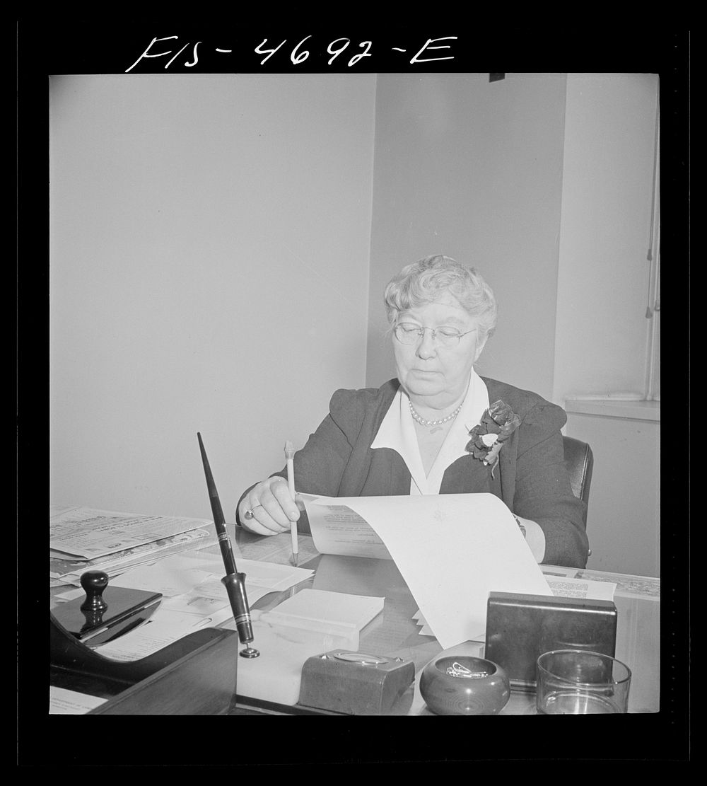 Washington, D.C. Mary Anderson, head of the Women's Bureau of the U.S. Department of Labor, at her desk. Sourced from the…