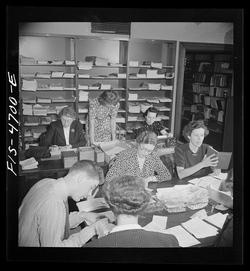 Washington, D.C. Volunteer translators in the Red Cross district library translating messages from many foreign languages:…