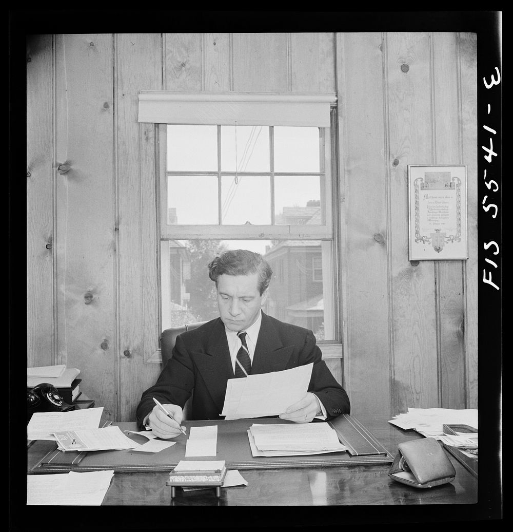 Washington, D.C. The Icelandic legation. Minister Thors studying a report in his chancery office. Sourced from the Library…