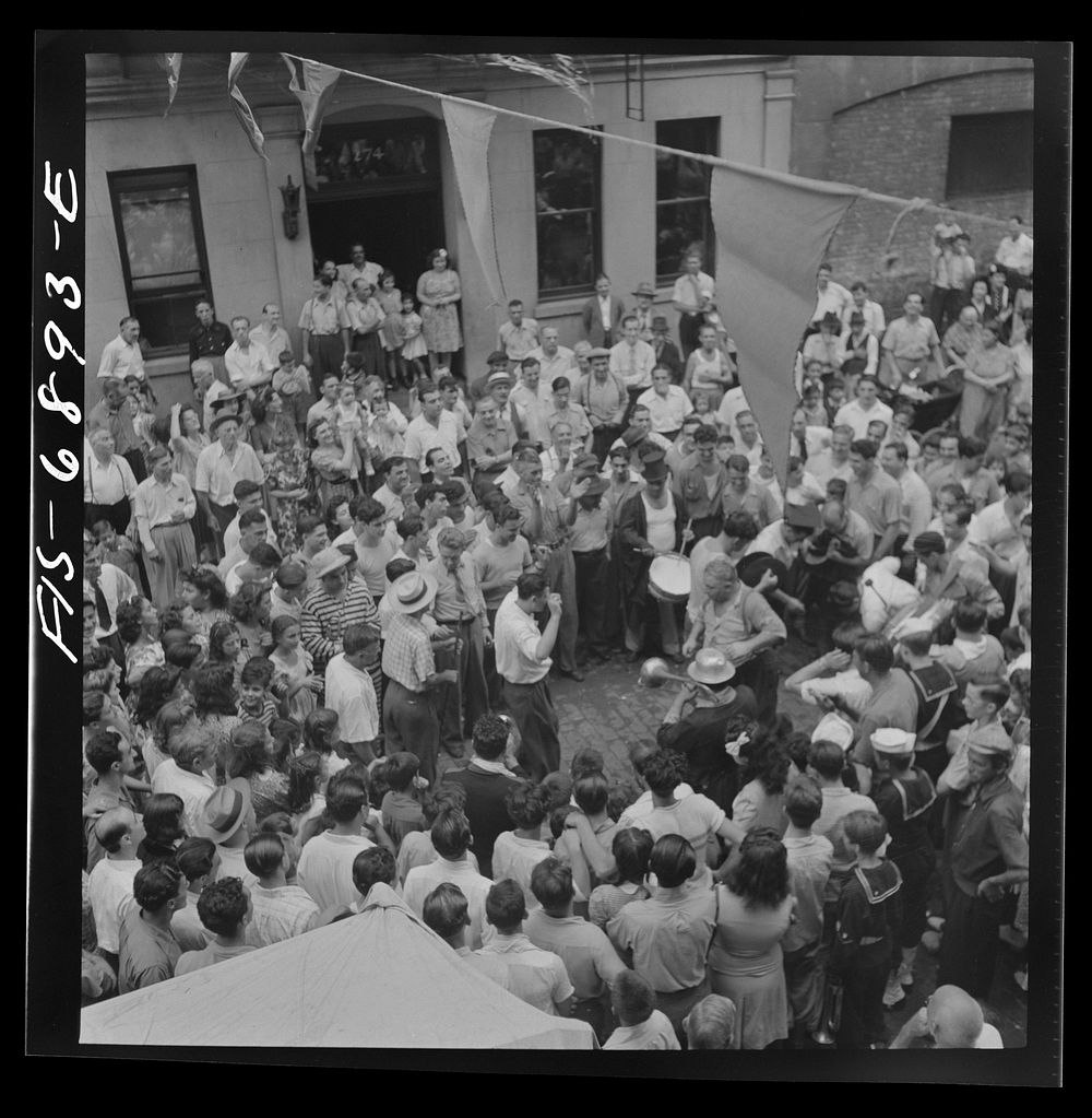 [Untitled photo, possibly related to: New York, New York. Dancing and music on Mott Street, at a flag raising ceremony in…