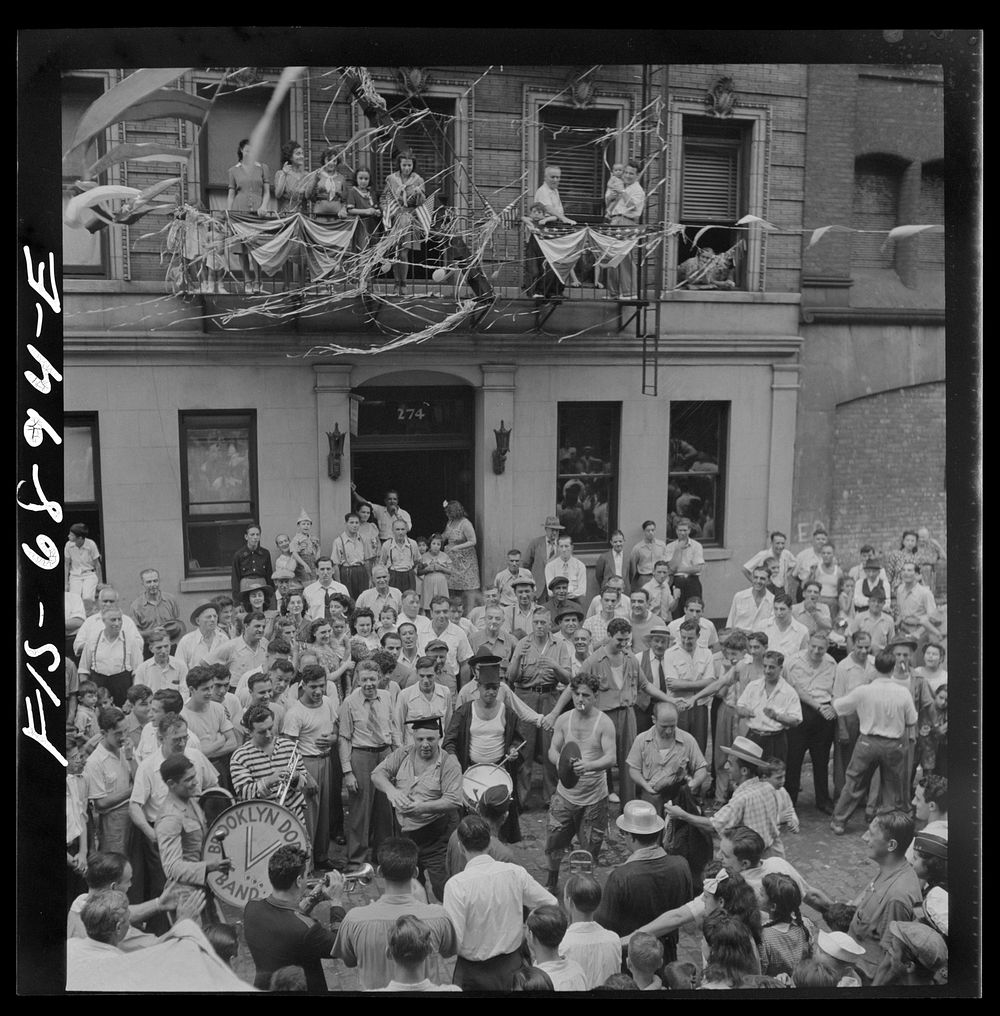 New York, New York. Dancing and music on Mott Street at a flag raising ceremony in honor of neighborhood boys in the United…