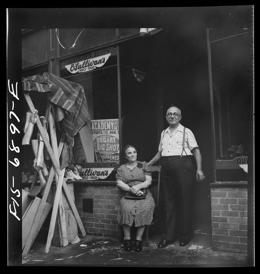 New York, New York. Shoemaker and his wife in the Italian section on Mott Street. Was images in honor of the feast of San…
