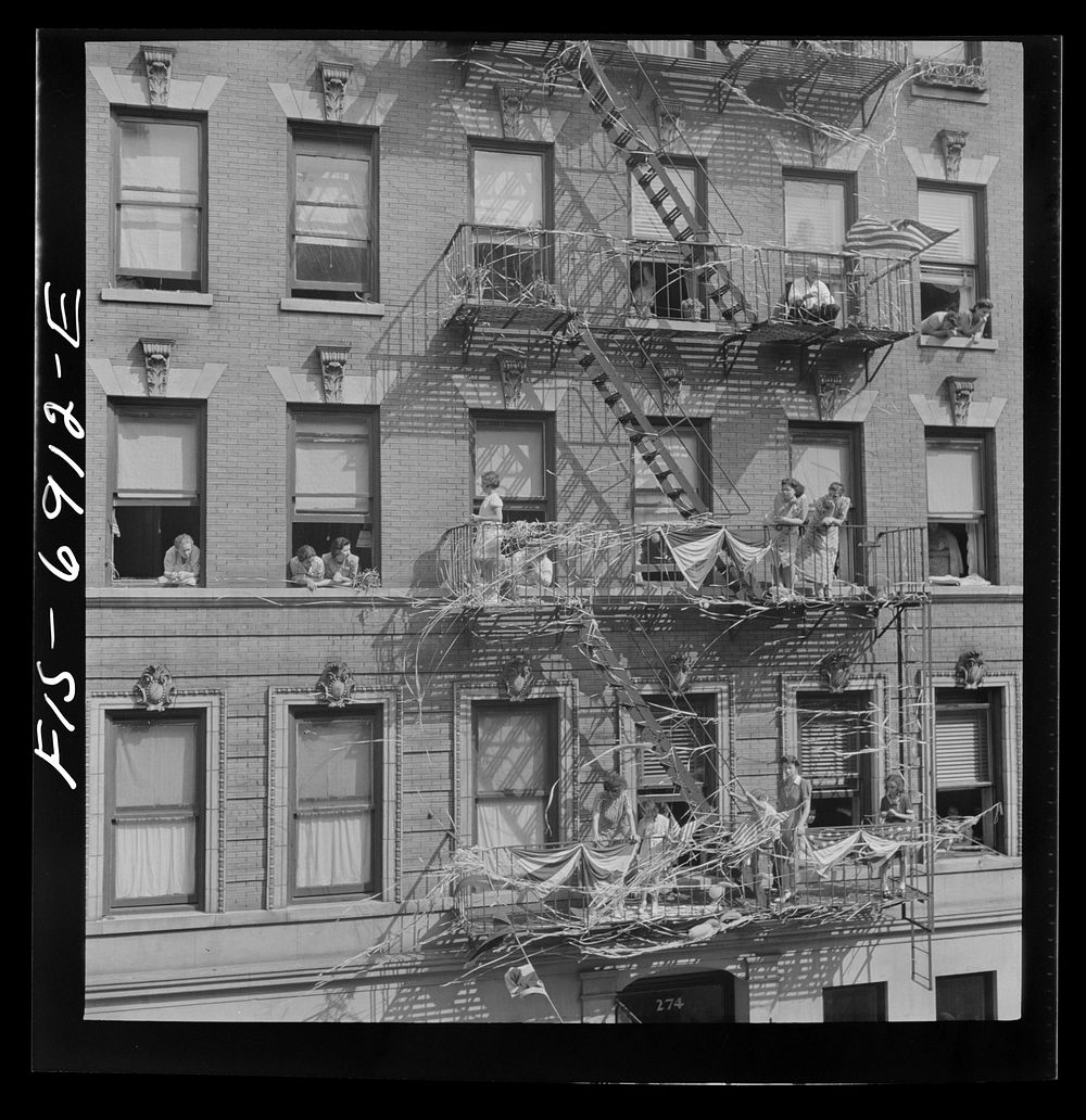 [Untitled photo, possibly related to: New York, New York. Italian-Americans in the rain watching a flag raising ceremony in…