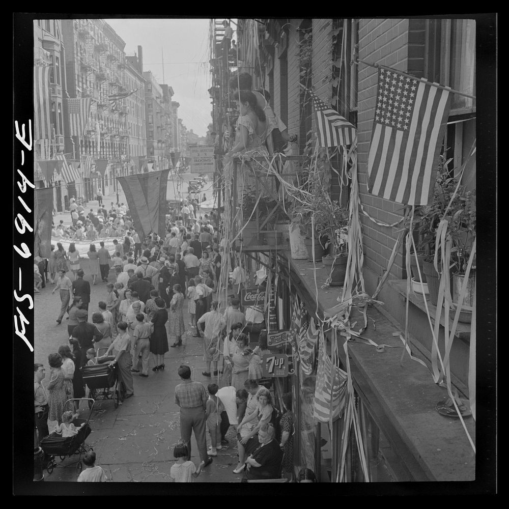 [Untitled photo, possibly related to: New York, New York. Flag raising ceremony in the rain in honor of Mott Street boys in…