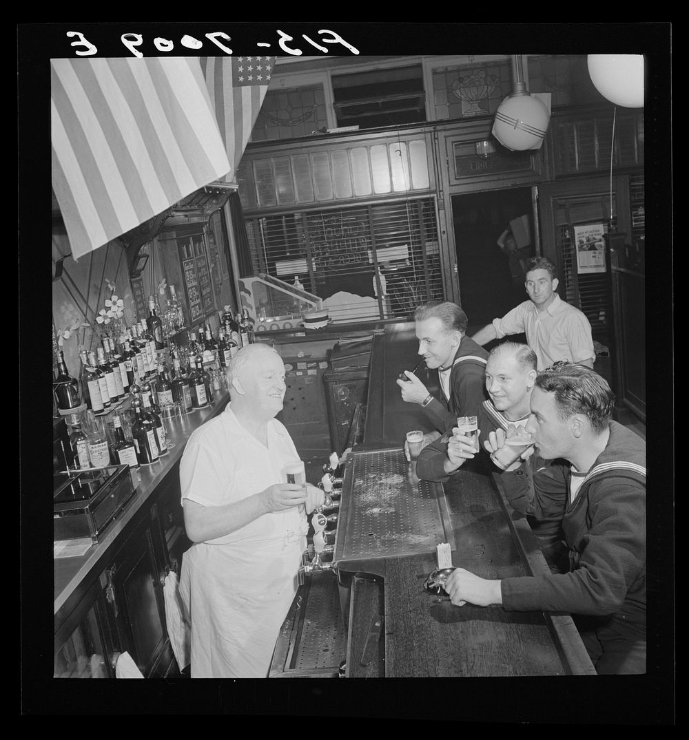 [Untitled photo, possibly related to: New York, New York. Irish-American bartender serving beer to British sailors in a…