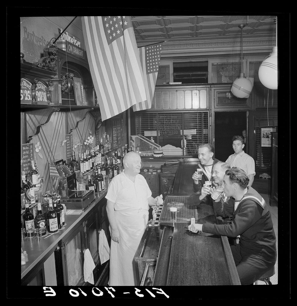 [Untitled photo, possibly related to: New York, New York. Irish-American bartender serving beer to British sailors in a…