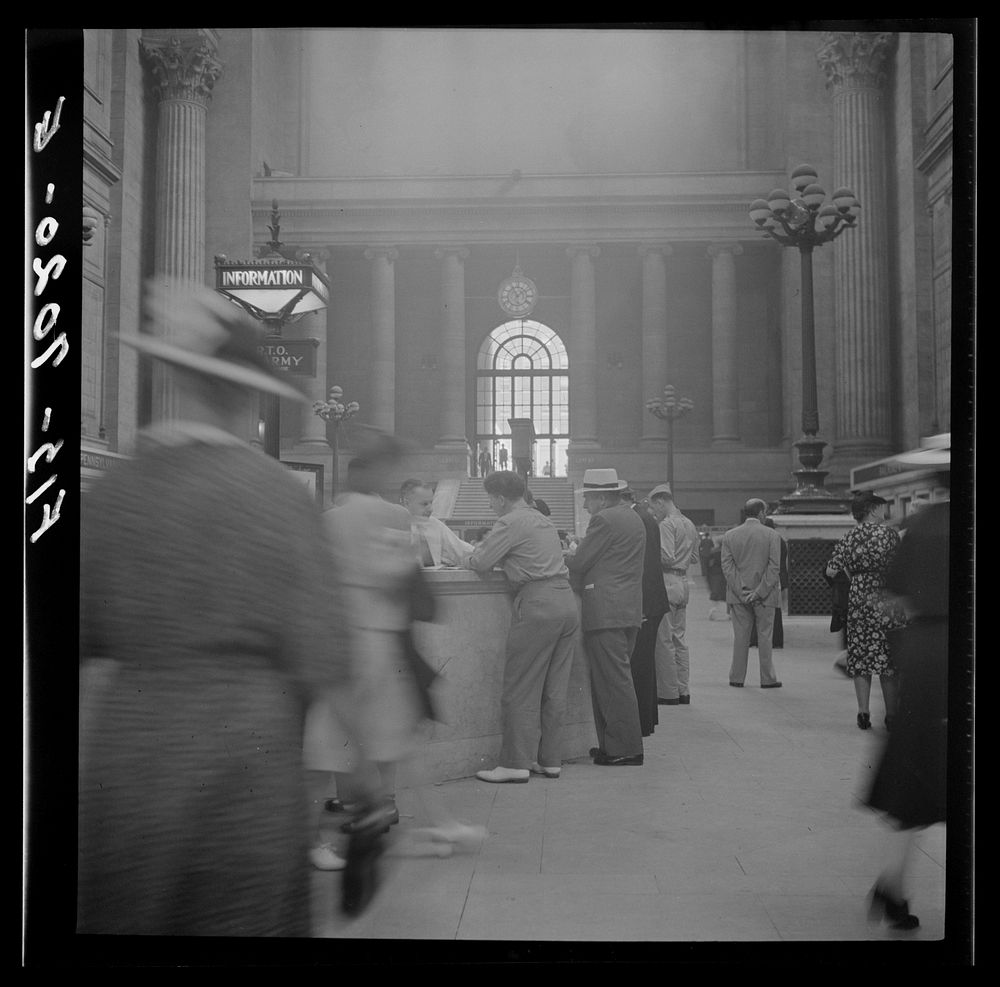 [Untitled photo, possibly related to: New York, New York. Information booth at the Pennsylvania railroad station]. Sourced…