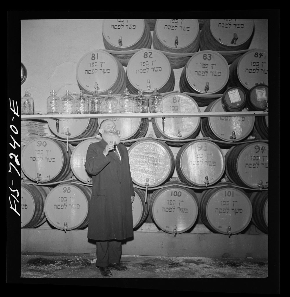 [Untitled photo, possibly related to: New York, New York. Rabbi in a kosher wine shop in the New York's Jewish section. His…