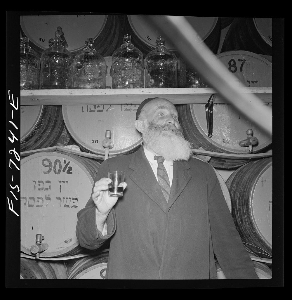New York, New York. Rabbi in a kosher wine shop in the New York's Jewish section. His job is to inspect wines to see that…