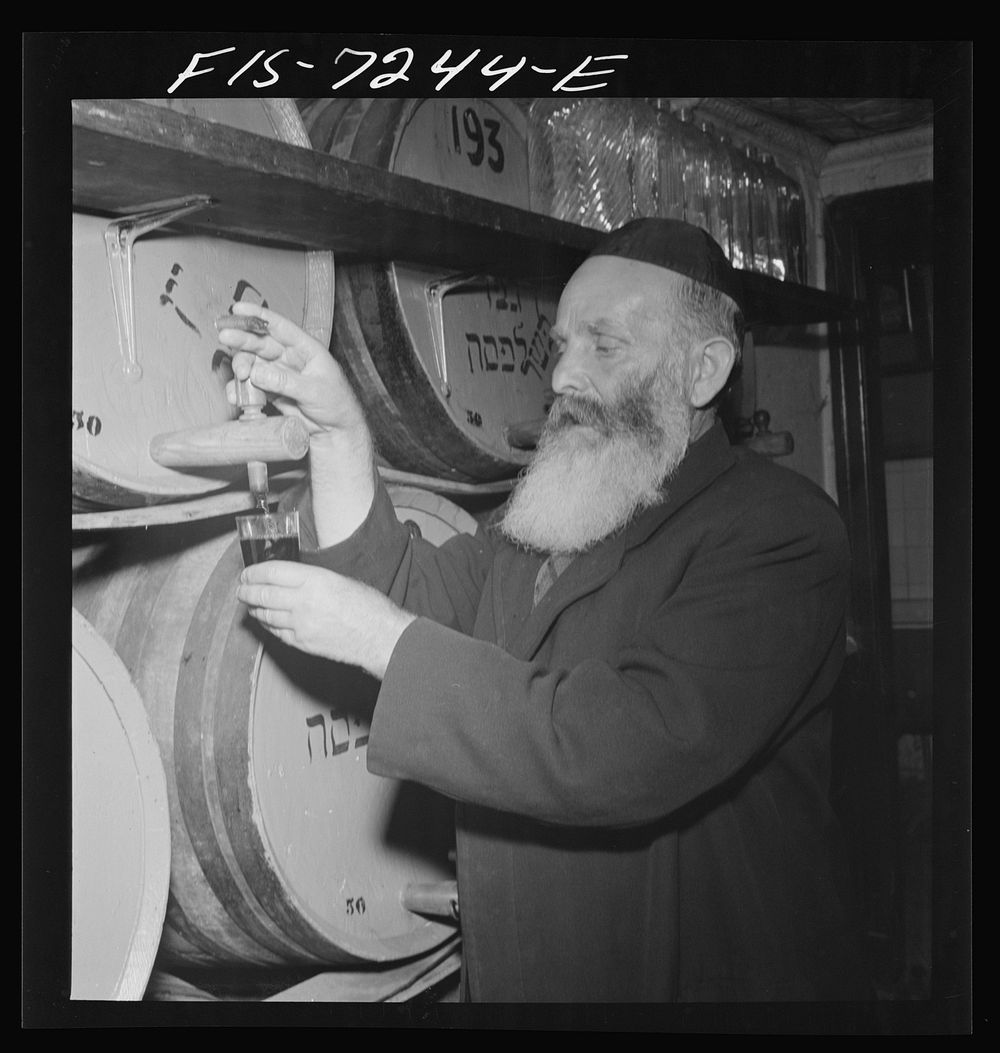 New York, New York. Rabbi in a kosher wine shop in the New York's Jewish section. His job is to inspect wines to see that…