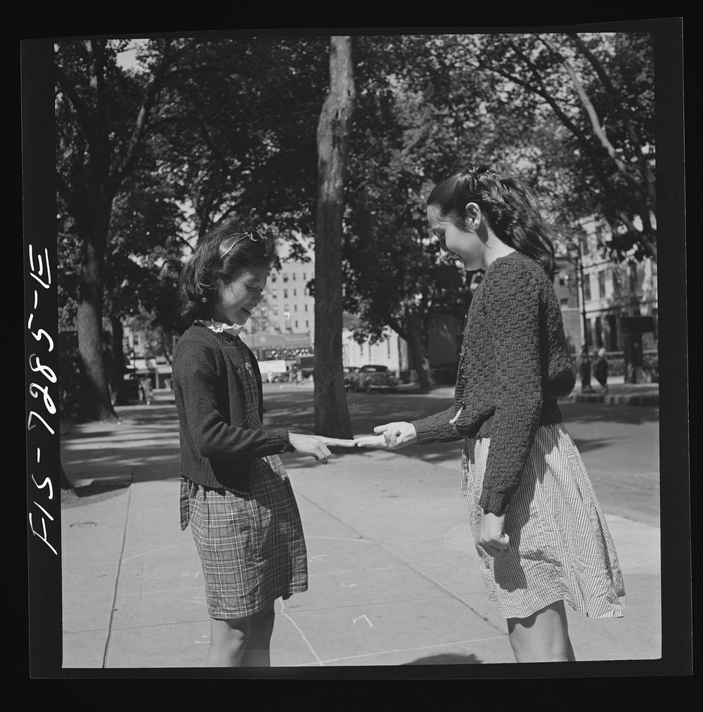 [Untitled photo, possibly related to: New York, New York. Chinese-American girl playing hopscotch with American friends…
