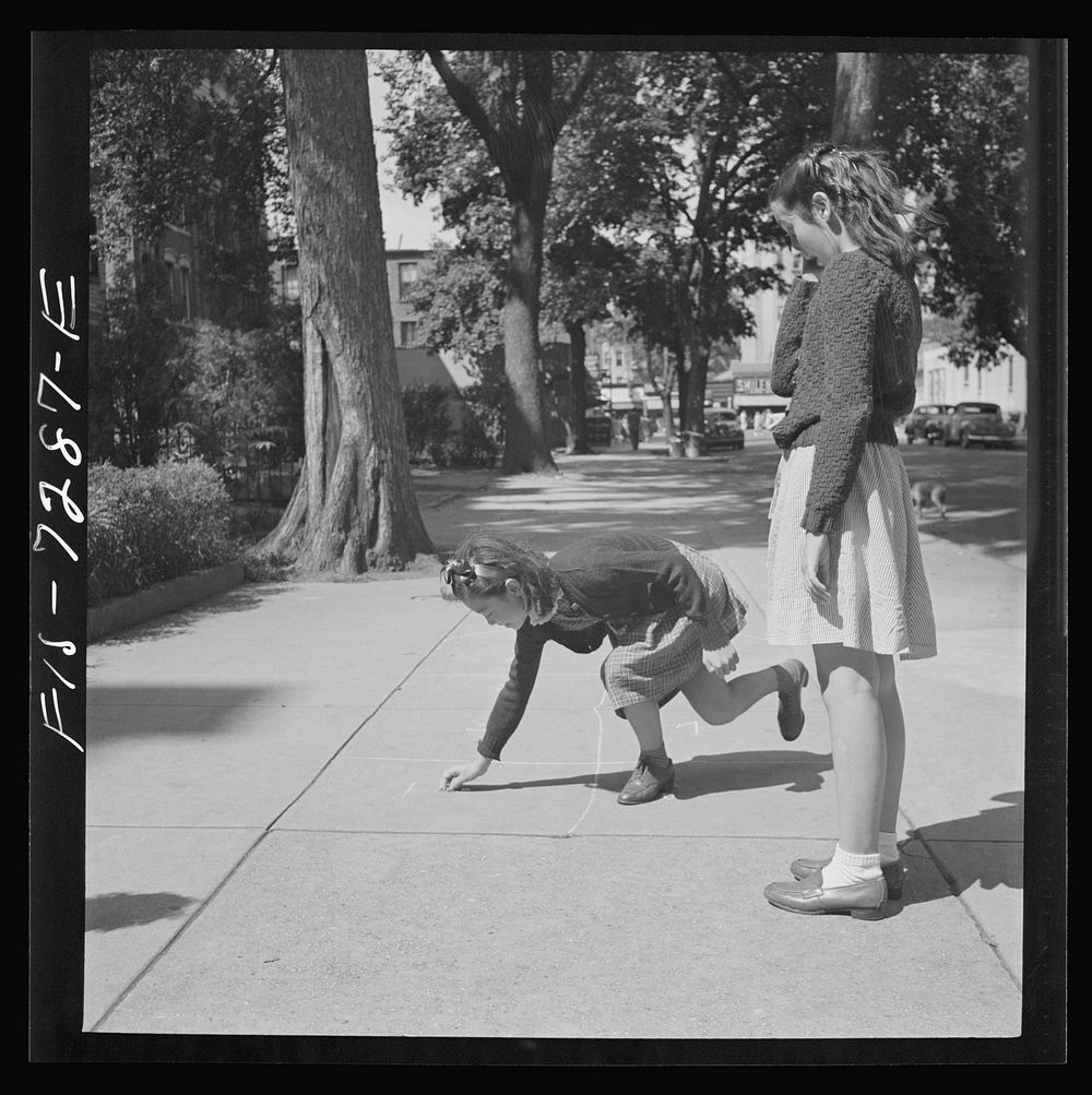 [Untitled photo, possibly related to: New York, New York. Chinese-American girl playing hopscotch with American friends…