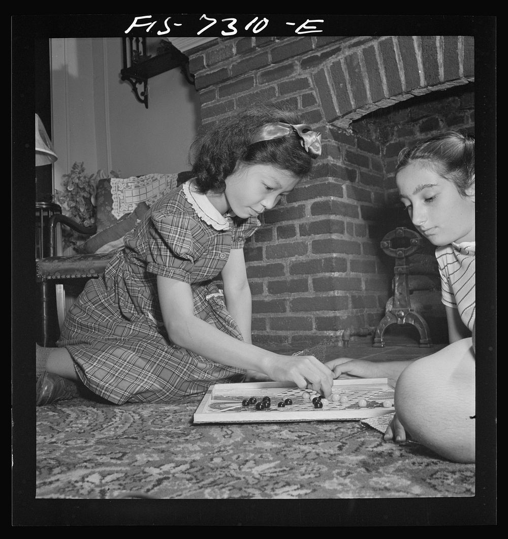 [Untitled photo, possibly related to: New York, New York. Chinese-American playing Chinese checkers with a Jewish friend in…