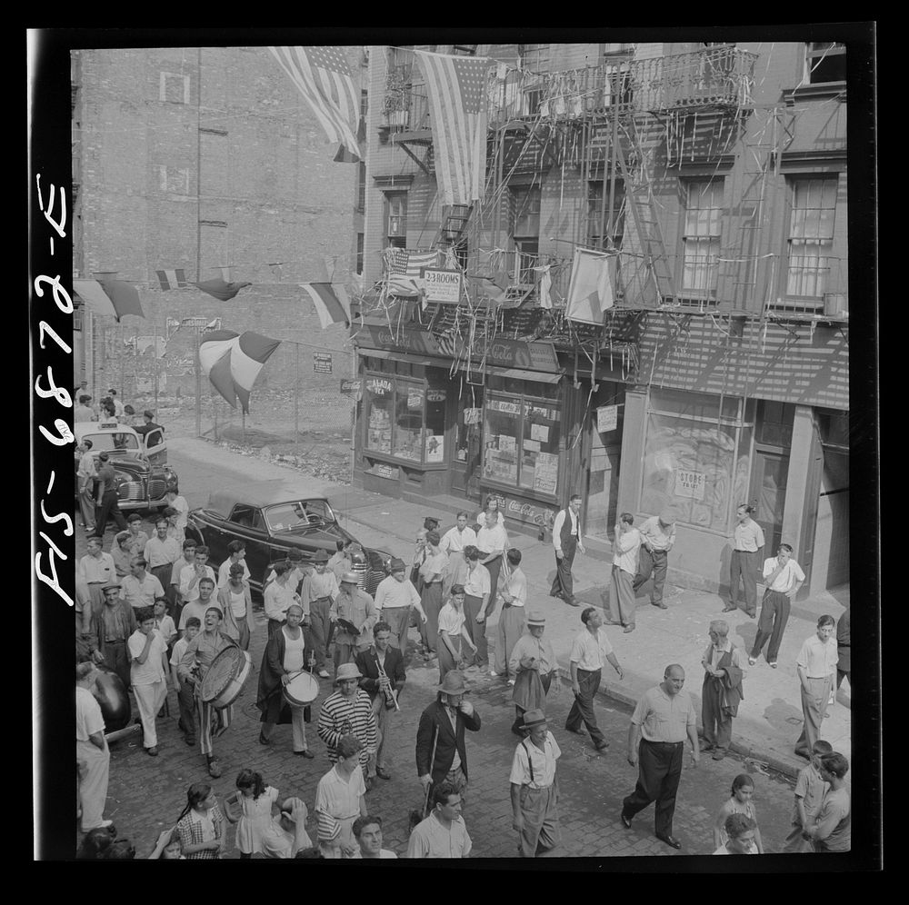 [Untitled photo, possibly related to: New York, New York. Parade of Italian-Americans on Mott Street at a flag raising…