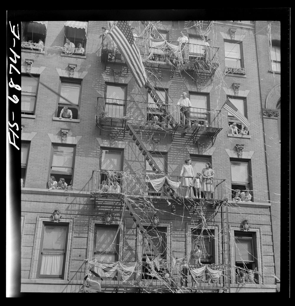 New York, New York. Italian-American watching parade on Mott Street and flag raising ceremony in honor of boys from the…