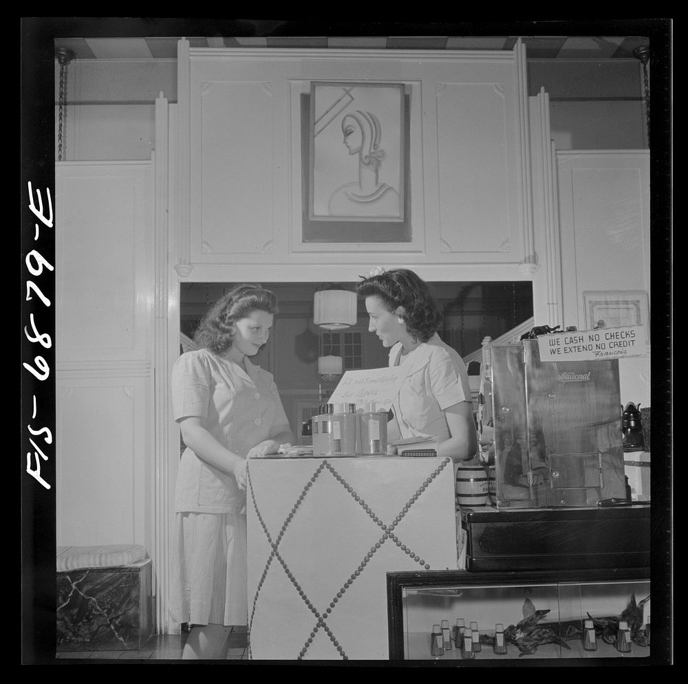 New York, New York. Receptionist making an appointment at Francois de Paris, a hairdresser on Eighth Street. Sourced from…