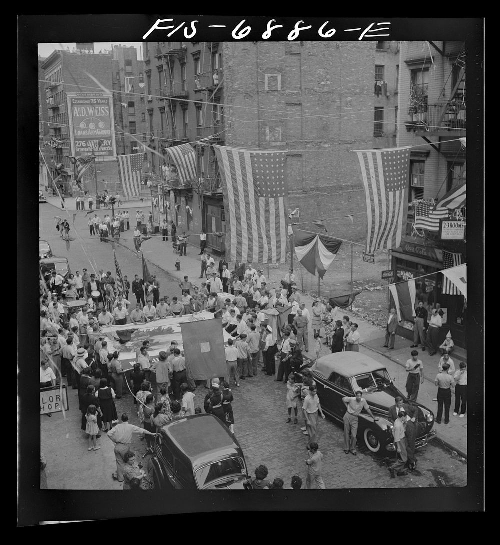 [Untitled photo, possibly related to: New York, New York. Parade of Italian-Americans on Mott Street at a flag raising…