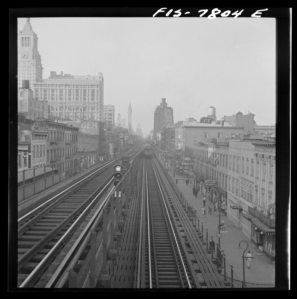 New York, New York. Looking north from the Ninth Street station on the Third Avenue elevated railway as a train leaves on…