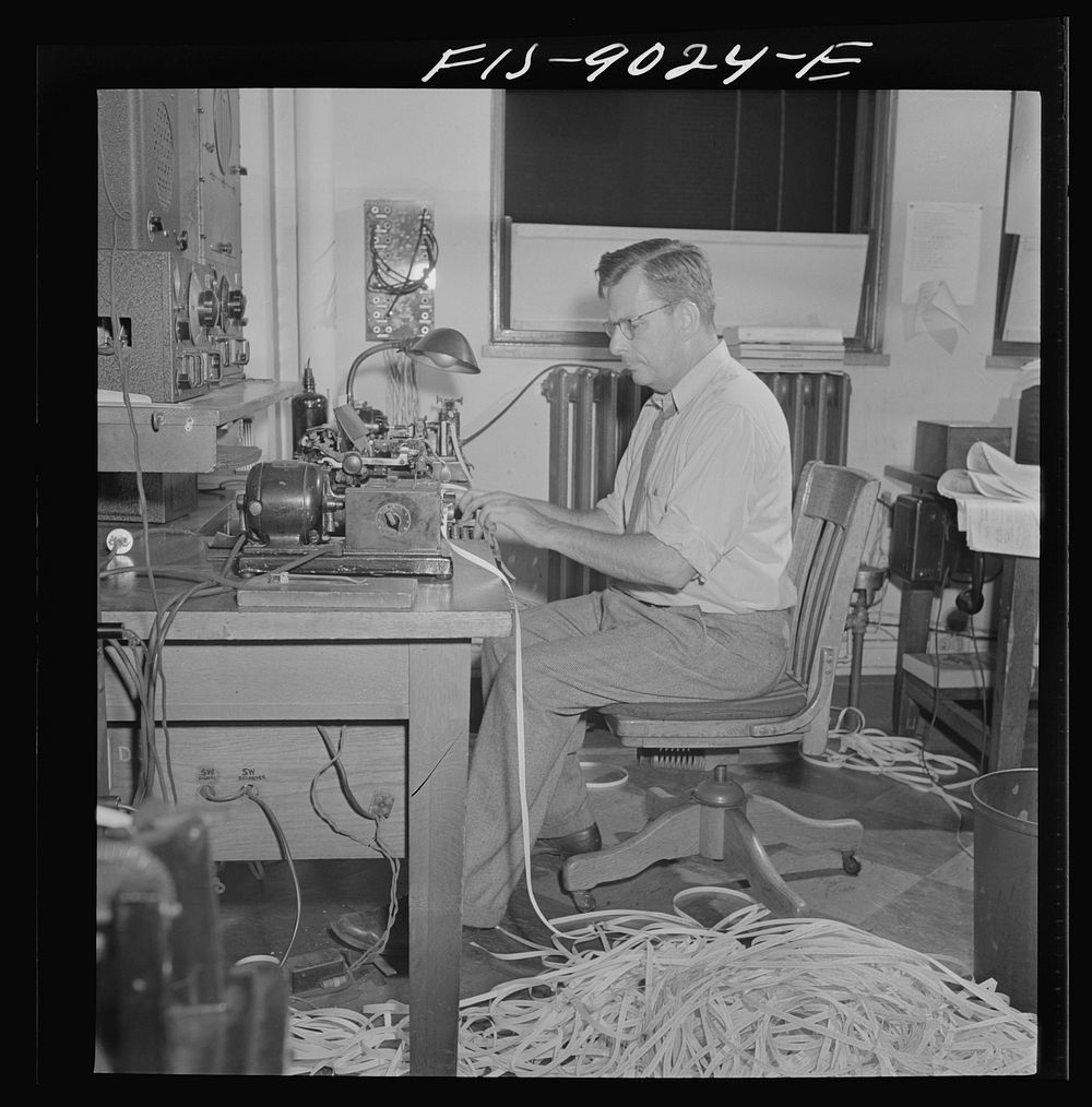 New York, New York. Radio room of the New York Times newspaper. The Times listening post, between 10 and 12 PM, between…