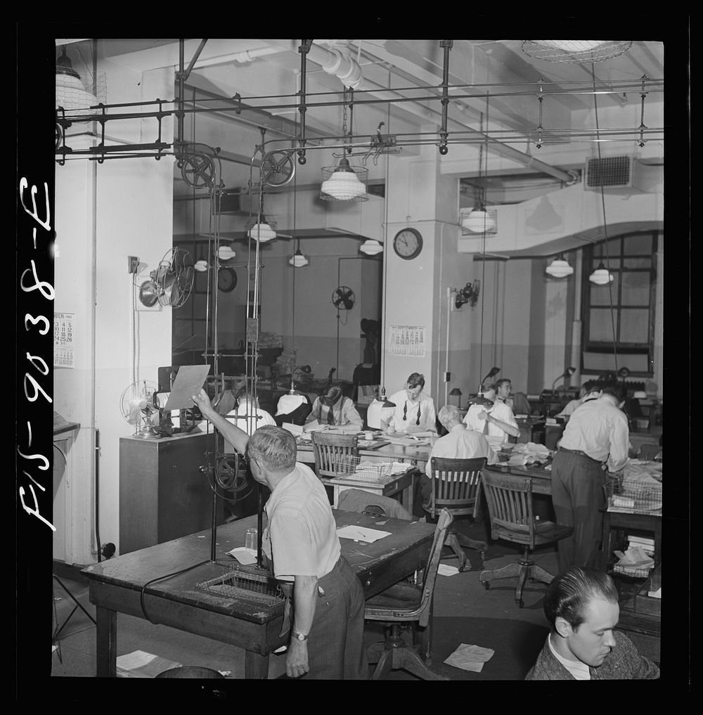 New York, New York. Newsroom of the New York Times newspaper. Ten o'clock is news room deadline. Copy is sent up to…