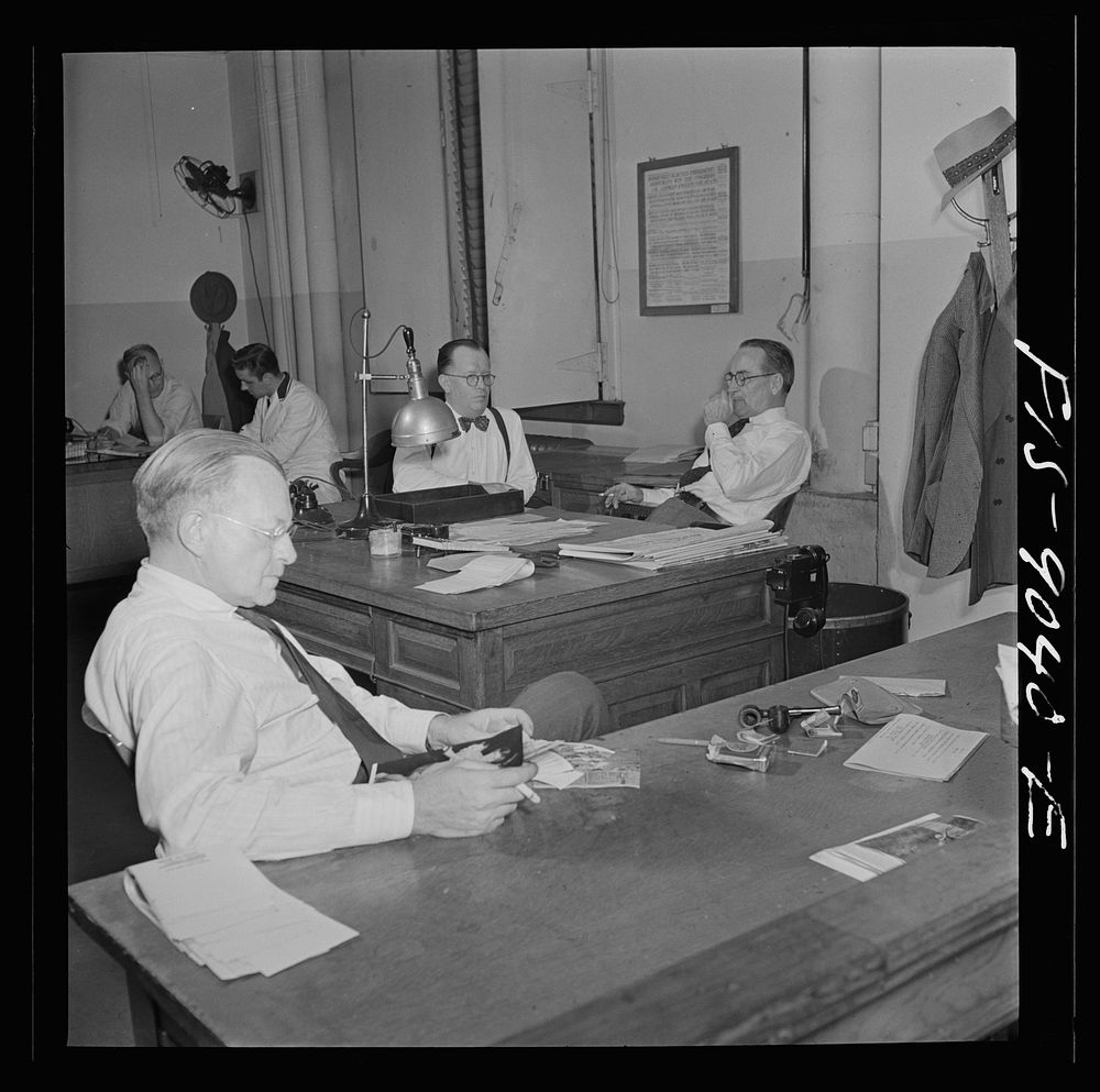 New York, New York. News room of the New York Times newspaper. The "bull pen" where managing editors and others sit at one…