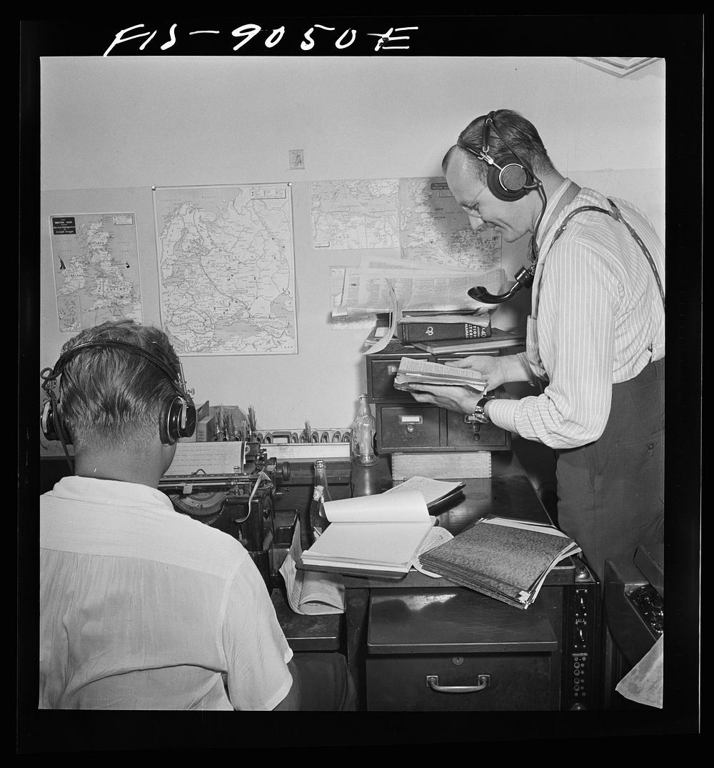 New York, New York. Recording room of the New York Times newspaper. Overseas shortwave telephone operators receive messages…