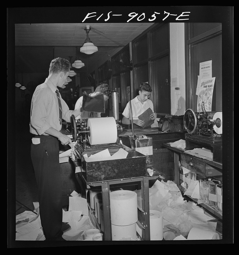 New York, New York. Wire room of the New York Times newspaper. Copy boys mimeograph all incoming dispatches which are then…