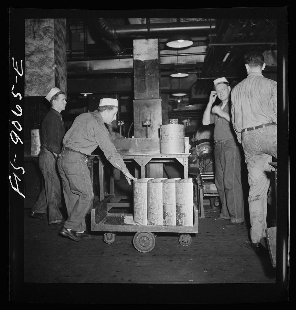 New York, New York. Pressroom of the New York Times newspaper. Transporting plates from shaver to presses on truck. Each…