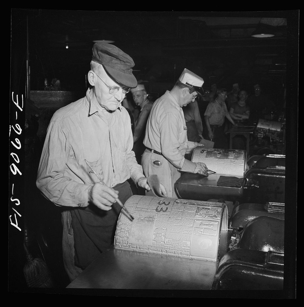 New York, New York. Pressroom of the New York Times newspaper. Numbering cast plates with page numbers for identification.…