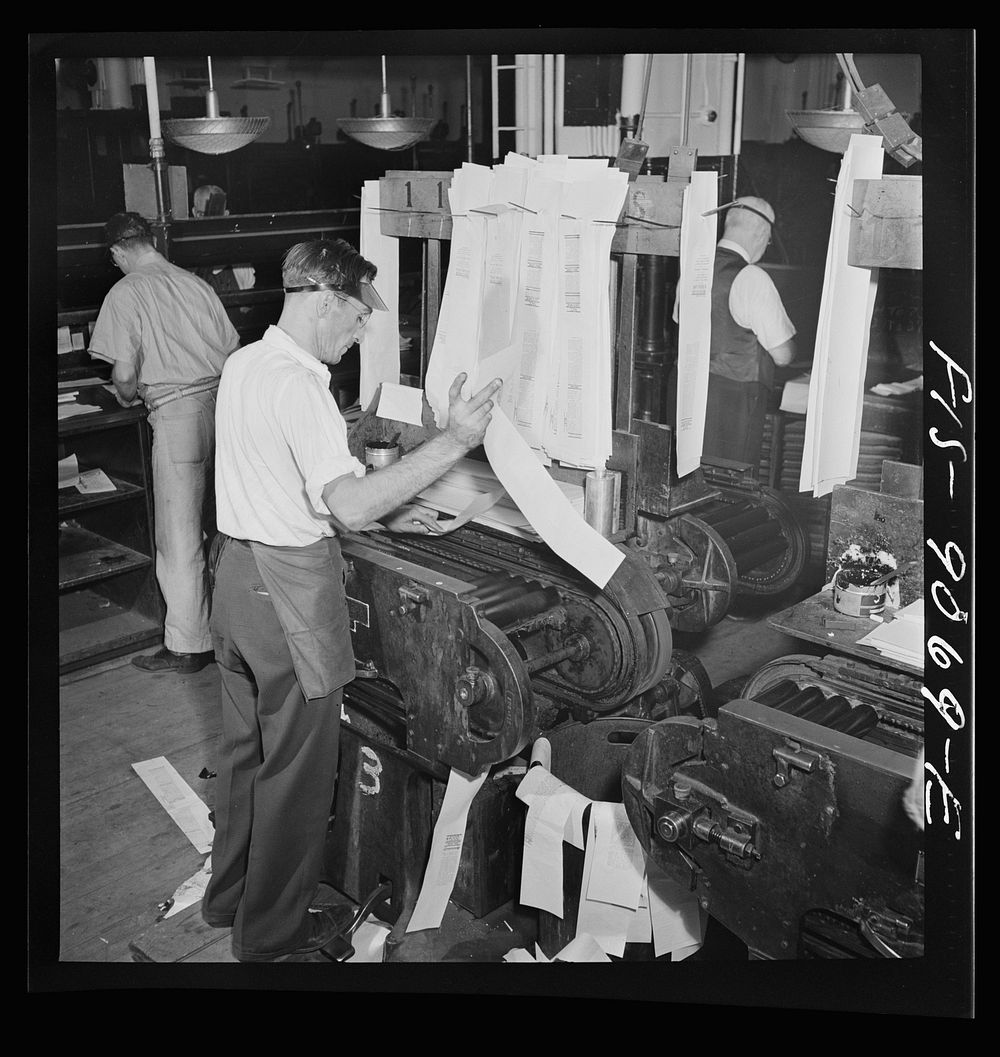 New York, New York. Composing room of the New York Times newspaper. Proof press turns out proofs for distribution to make-up…
