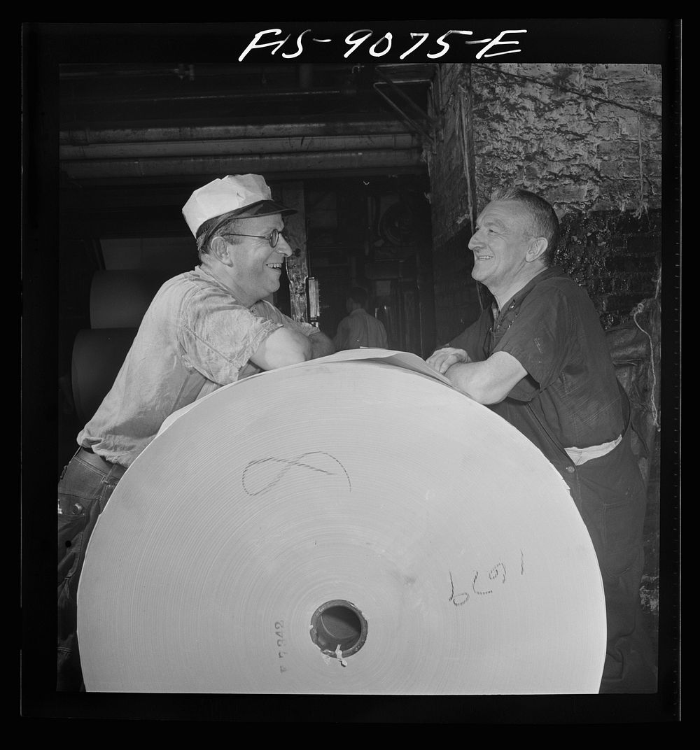 New York, New York. Reel room of the New York Times newspaper. Pressman resting between editions. Sourced from the Library…