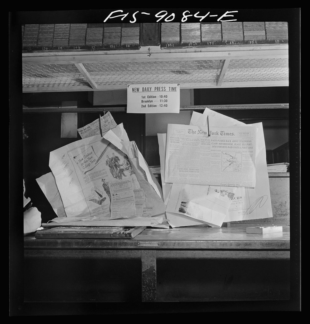New York, New York. Composing room of the New York Times newspaper. Proofs on wall in the advertising end of the room.…
