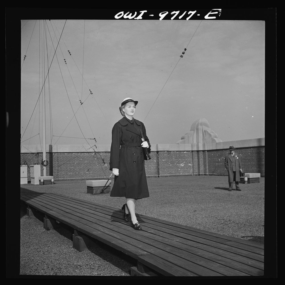 New York, New York. Powers Agency model in a WAVE's (Women Auxiliary Volunteer Emergency Service) uniform overcoat. Sourced…