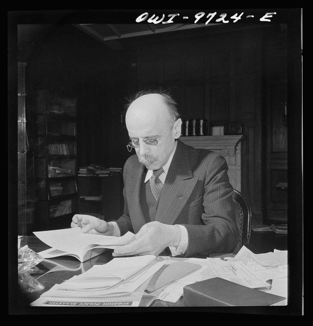 Washington, D.C. The Turkish Embassy. Ambassador Ertrogren [i.e., Ertegun] at work at his desk. Sourced from the Library of…
