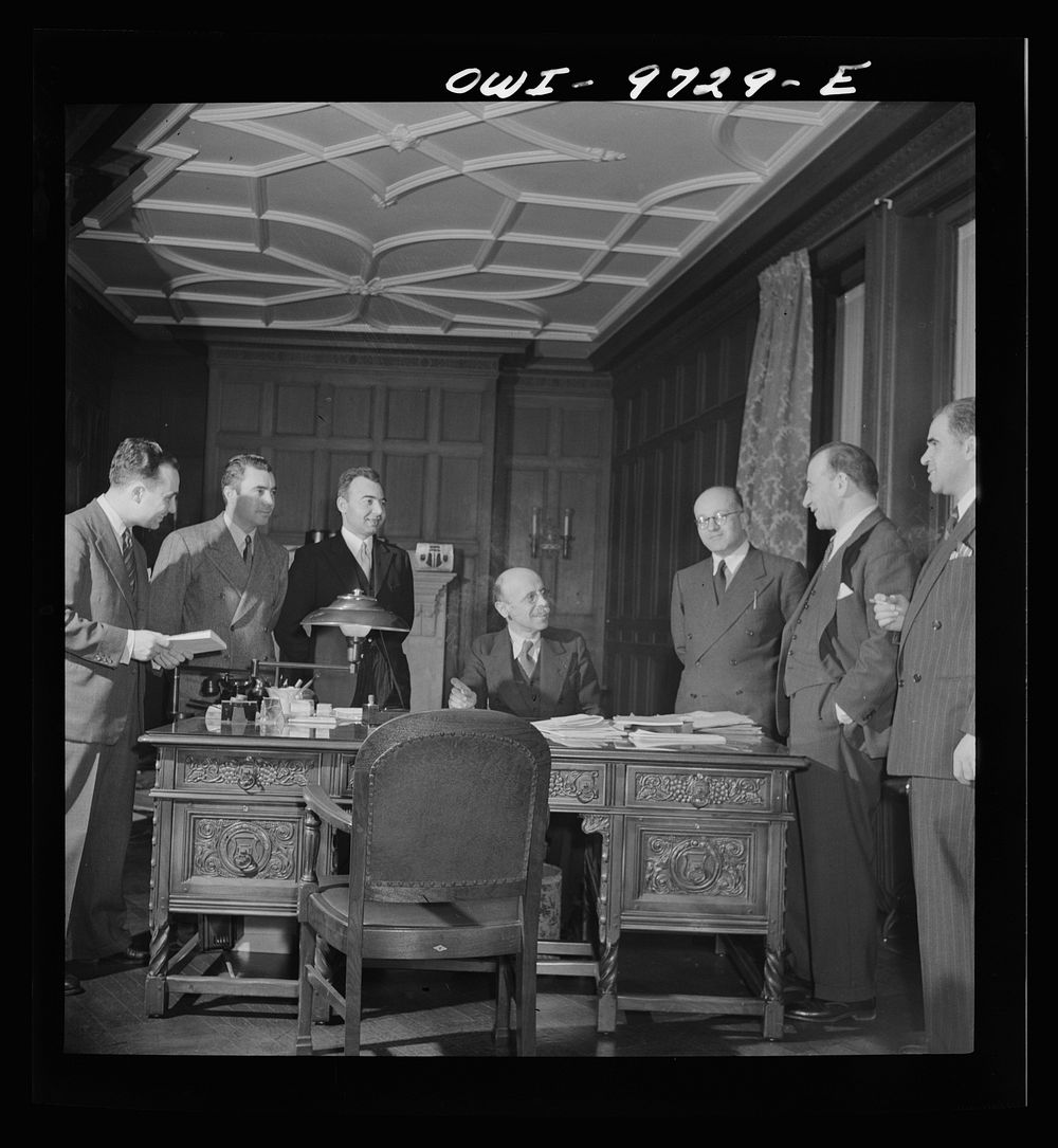 Washington, D.C. The Turkish Embassy. Ambassador Ertrogren [i.e., Ertegun] and his staff in his office. Sourced from the…